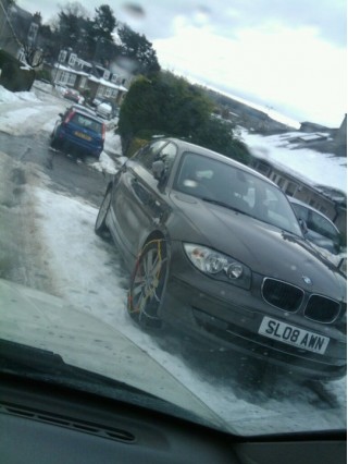 bmw-1-series-with-snow-chains-on-front-wheels-staffordshire-england-dec-2010-photo-by-andy-smith_100334419_s.jpg